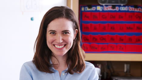 female elementary school teacher looking to camera, close up