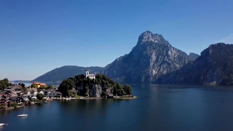 flight over traunkirchen church on traunsee lake, in salzkammergut, upper austria.