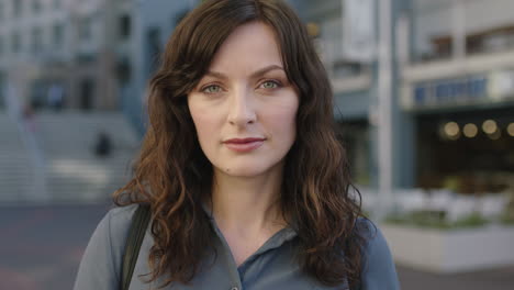 close up portrait of lovely elegant woman on busy urban sidewalk looking pensive thoughtful staring serious