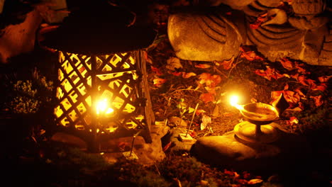 lamps and incense are seen in time-lapse motion with a buddha statue in the background