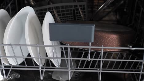 dishes and pan inside dishwasher