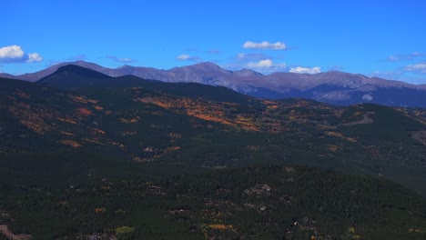 mount blue sky evans aerial drone peak fall autumn colors conifer evergreen colorado clouds maxwell falls scenic byway echo lake sunny morning 14er peaks summit shadow mountain backwards pan up motion
