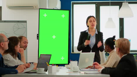 leader of company presenting financial plan using mockup display in front of diverse team