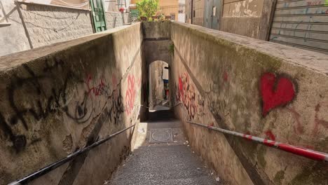 staircase with graffiti and litter in naples