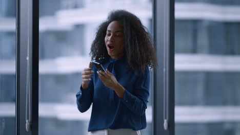 happy woman executive enjoy business success by window in office building.