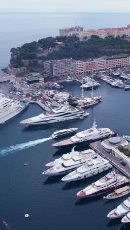 port de monaco, monte carlo. vertical drone aerial view of boats and yachts in harbor