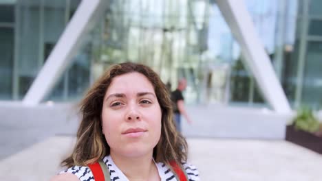 young woman vlogging in city center