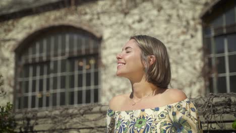 young caucasian blonde woman looks around and smiles