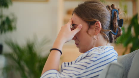 Upset-Businesswoman-Contemplating-on-Sofa