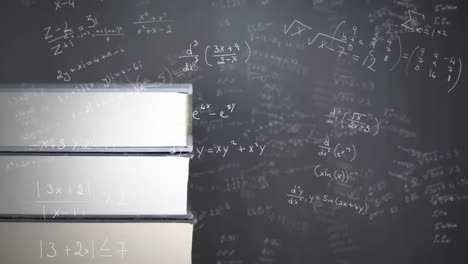 Stack of books against mathematical equations on black board
