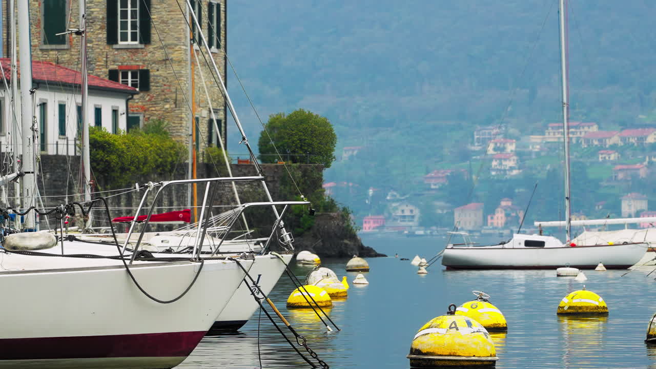 Yachts anchored on the coast of Bellagio, Lake Como, Italy