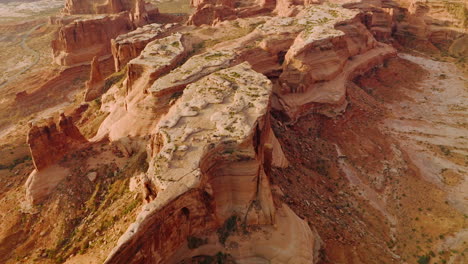 approaching the plain tops of bare canyons in the usa national park. majestic rocks in the deserts of utah from aerial perspective.