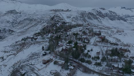 aerial establishing shot of farellones deep into the andean mountain range