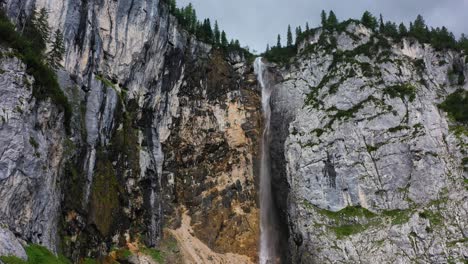 austrian alps waterfall forest mountain push in aerial