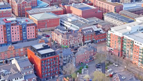 aerial drone tilts up in sheffield united kingdom traditional city buildings and streets, uk cityscape