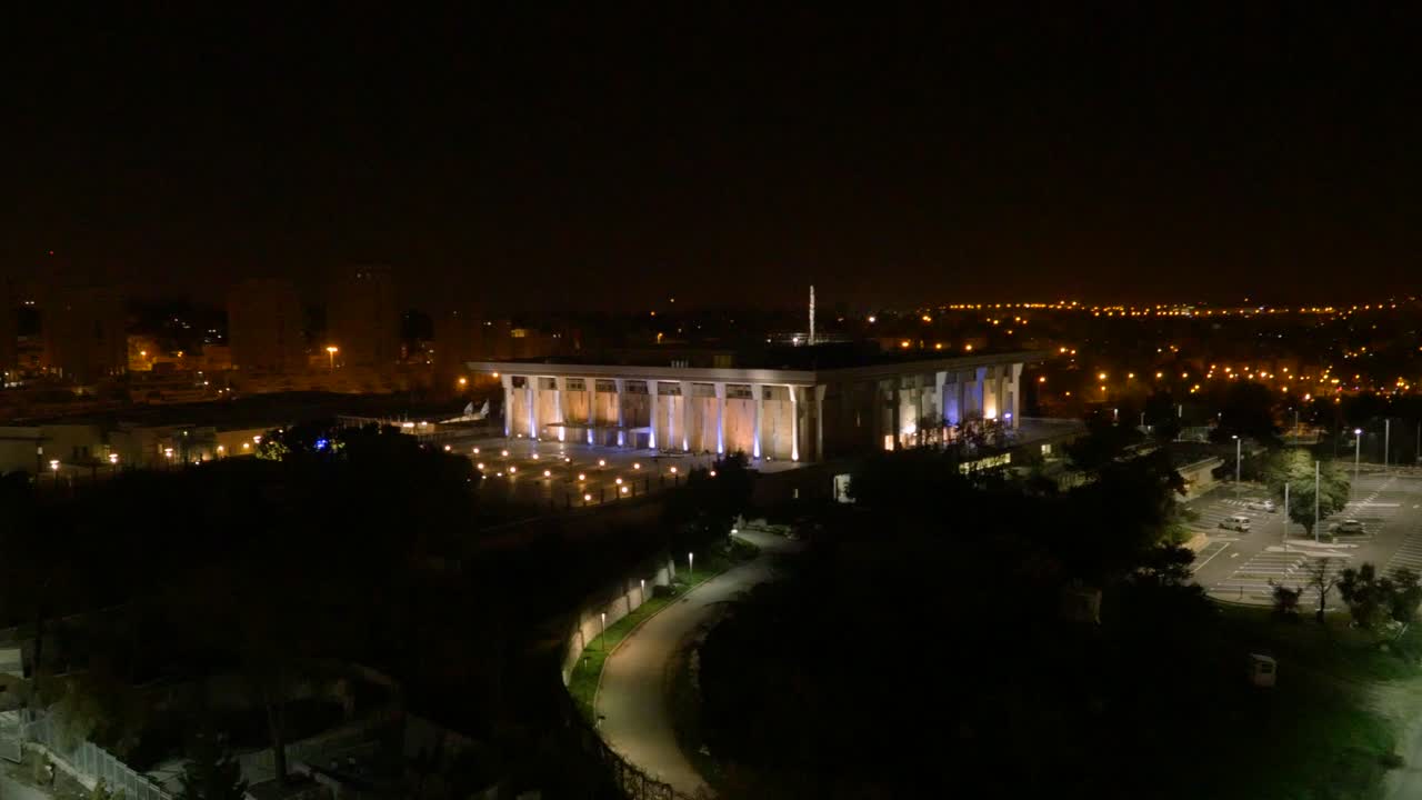 Beautiful night scene of the Knesset lightened. Aerial rising