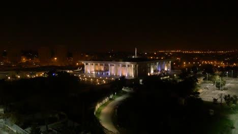 beautiful night scene of the knesset lightened. aerial rising