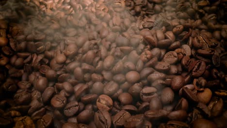 close up of seeds of coffee. fragrant coffee beans are roasted smoke comes from coffee beans.