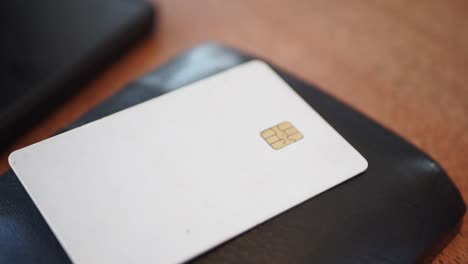 close-up of a white credit card with a chip