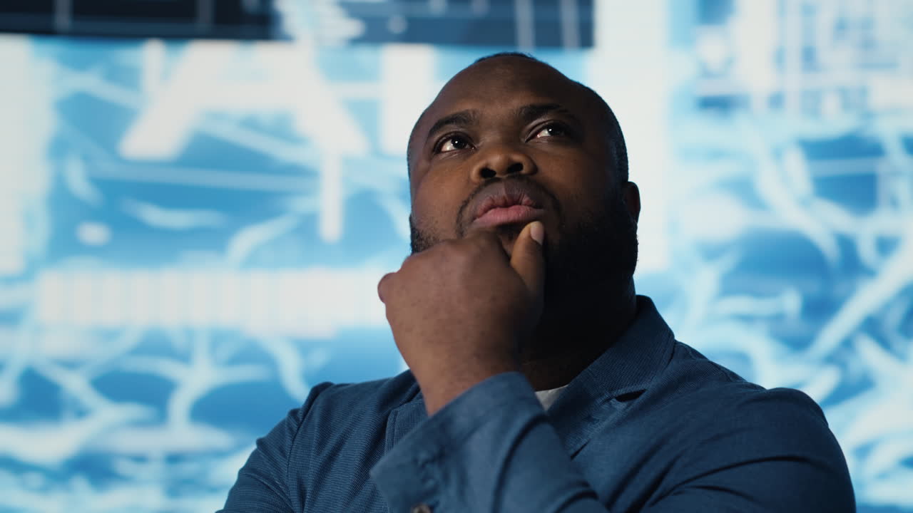 African American IT specialist examining artificial intelligence interface