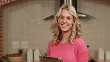 smiling woman using tablet
