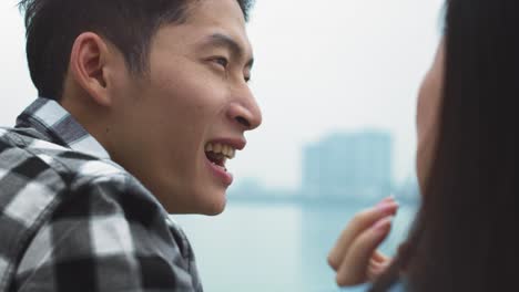 Handheld-view-of-Vietnamese-man-talking-with-his-girlfriend