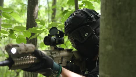 slow motion tactical army guy brings gun up