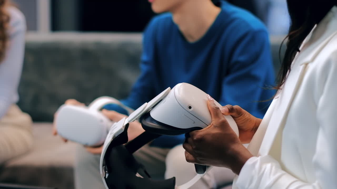 Business conference in VR in an office. Multiracial group of people exploring VR glasses and controllers