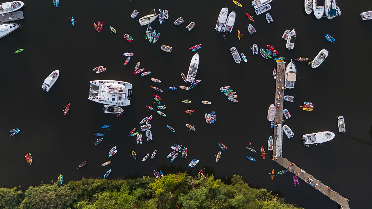 Overhead View Of Boats And People Kayaking In Annapolis, USA. - aerial timelapse shot. Concert on the water with boats gathered around