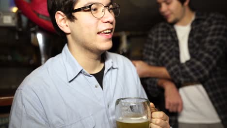 friends enjoying beer at a bar