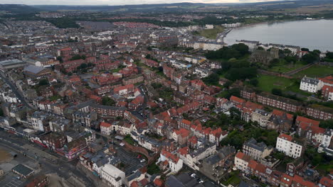 Establishing-Drone-Shot-Over-Scarborough-Coastal-Town-on-Overcast-Day