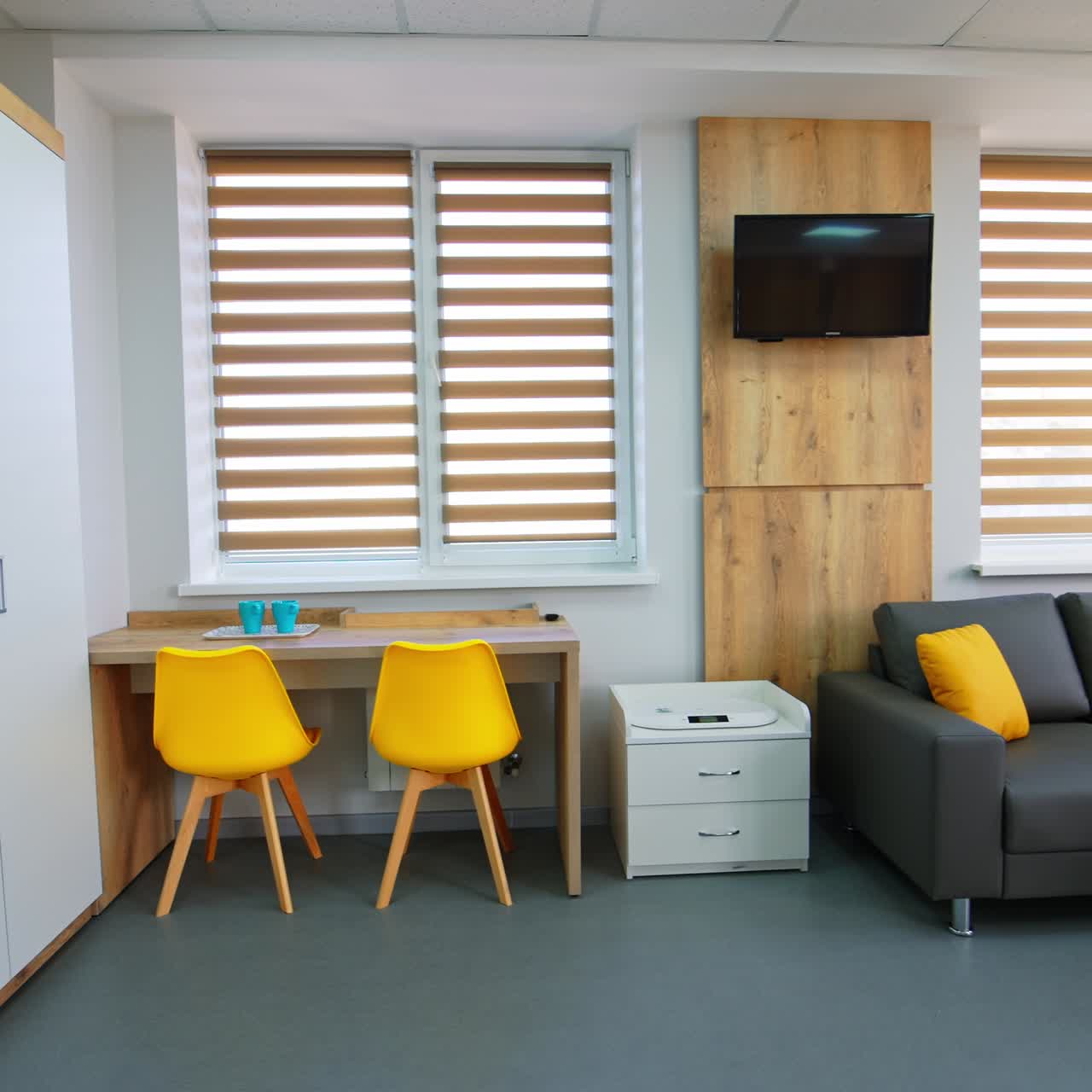 Ward in maternity hospital for new mothers. Well-equipped room for parents and their newborn baby on the first days after birth