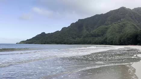 A-serene-beach-scene-with-gentle-waves-lapping-against-the-shore