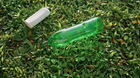 plastic trash lying grass symbolize environmental pollution. pet waste on nature