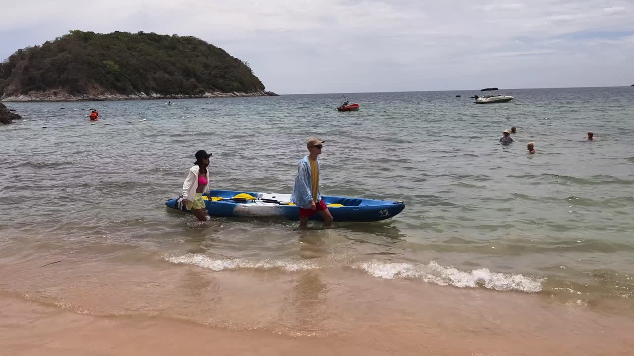 Couple Kayaking at Tropical Beach