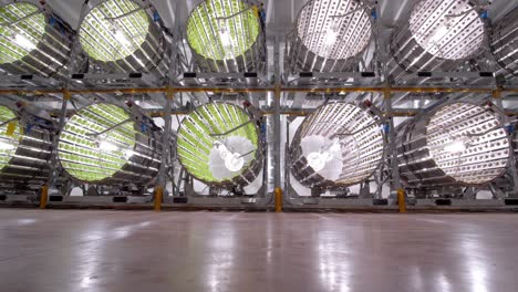 huge cylinders in a covered hall in which vegetables are grown