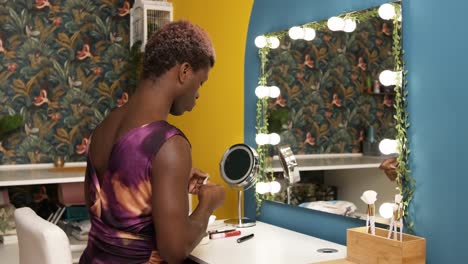 transgender african man ready to make up in a backstage