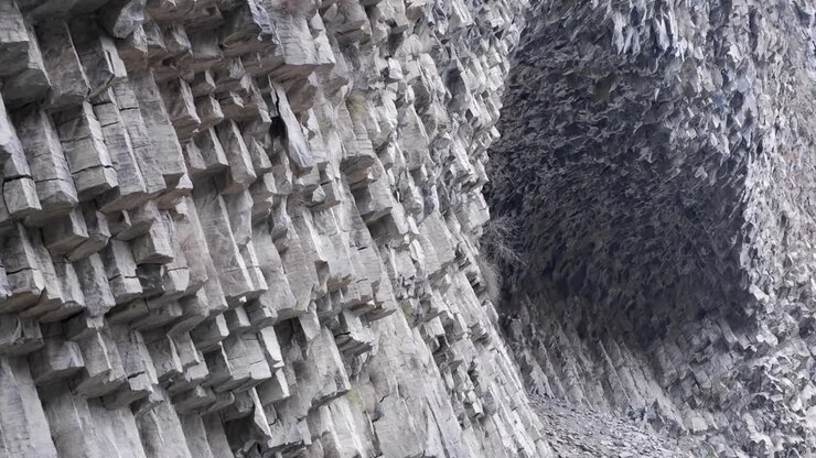 Tilt pan across shattered basalt pillars: Symphony of Stones, Armenia