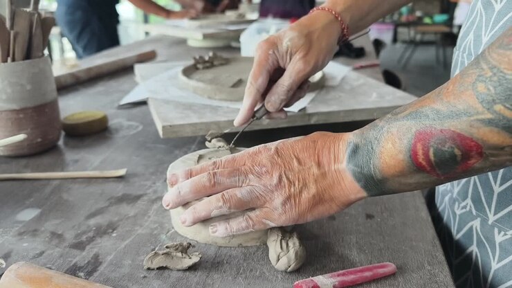 Close-up of Hands Shaping Clay in a Pottery Workshop