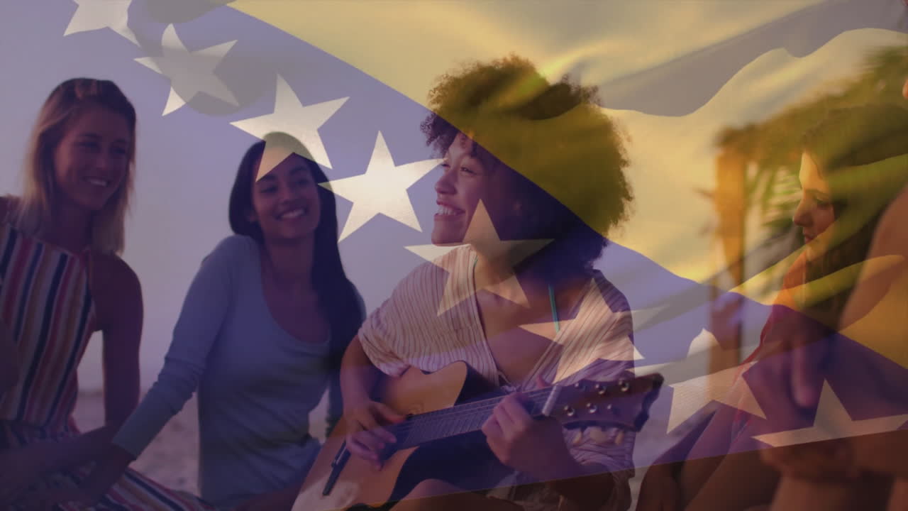 On beach, women listening to music with flag animation overlay in background