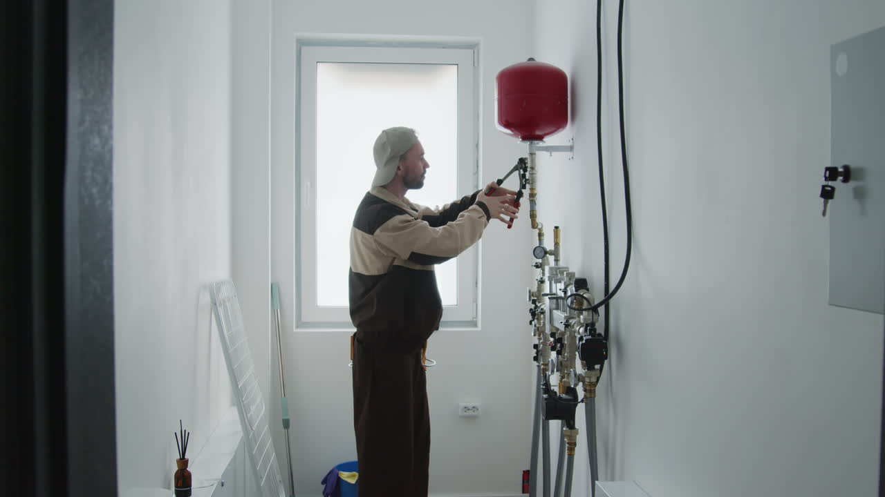 Plumber Fixing Water Heater Expansion Tank