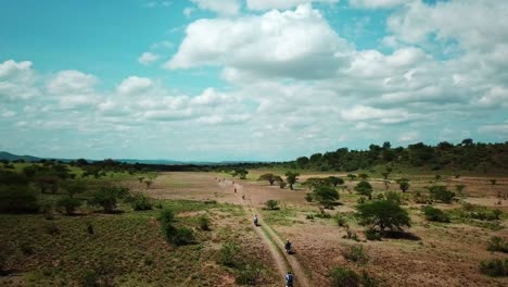 riders on safari tours within the national park near lake magadi in kenya, east africa