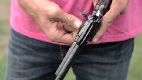 4K-60-Fps-Slow-Mo-22Mm-Hand-Gun-Loading-Bullets-Into-The-Revolver-Shells-Shooting-Target-Practice