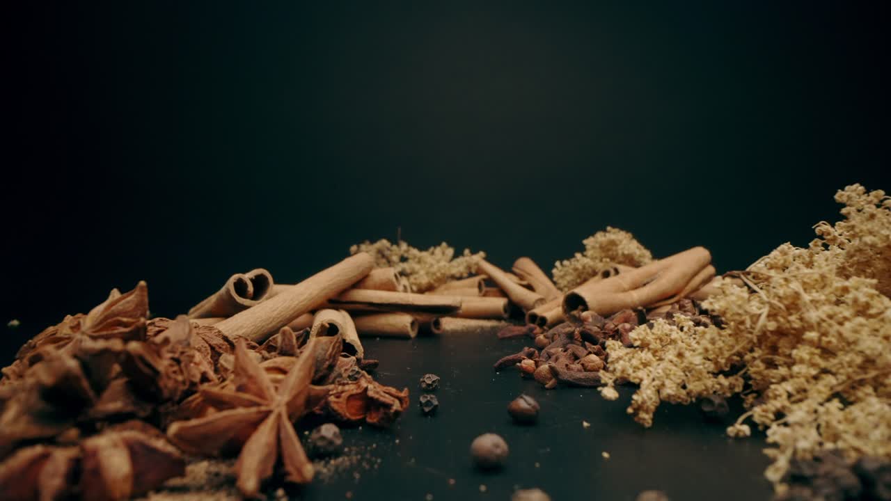 macro Dolly Shot of cinnamon, elderflower, cloves roots and spice tea