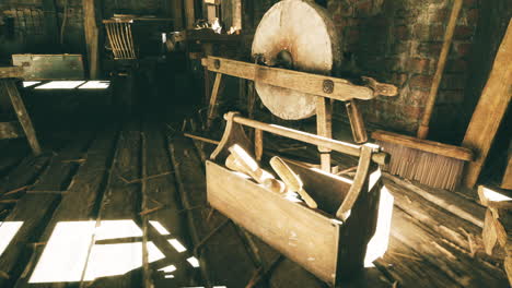 Tools and grinding wheel in a rustic workshop setting