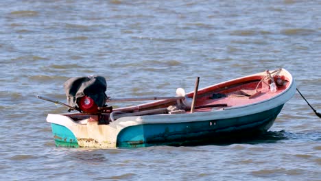 small fishing boat on calm water