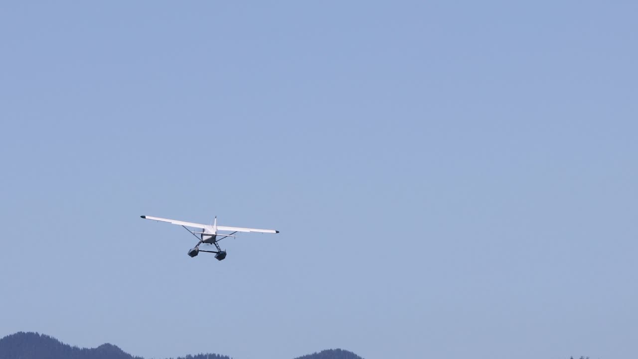 Seaplane flies away at Canada's west coast in Tofino on Vancouver Island