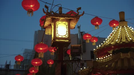 chinese lanterns in kobe's china town, evening lamps lighting up at night