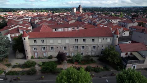 aerial shot above saint just saint rambert city center during the day, loire departement, auvergne rhone alpes region, france