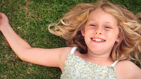 Cute-girl-lying-on-the-grass